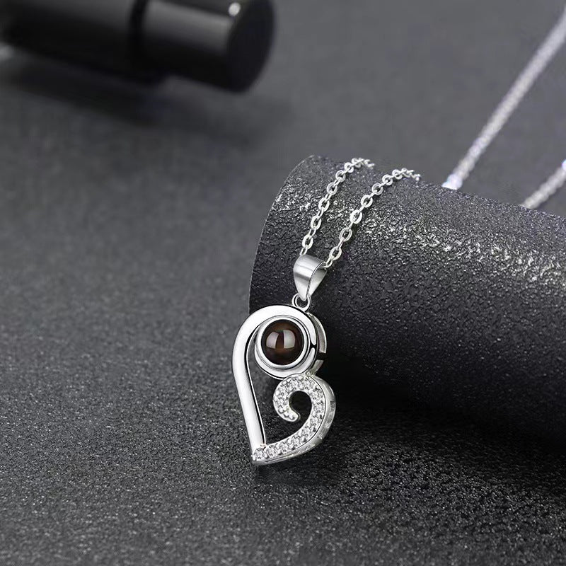 Trendy black and white matching heart design projection necklace