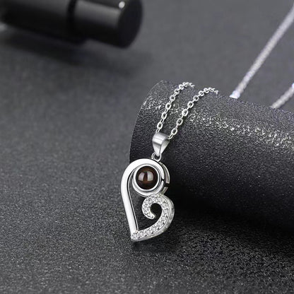 Trendy black and white matching heart design projection necklace